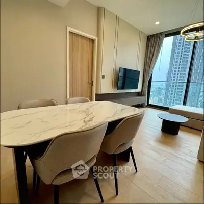 Modern living room with elegant dining area and city view