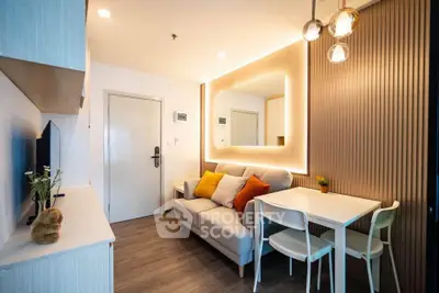 Modern living room with stylish decor and cozy seating area in a contemporary apartment.