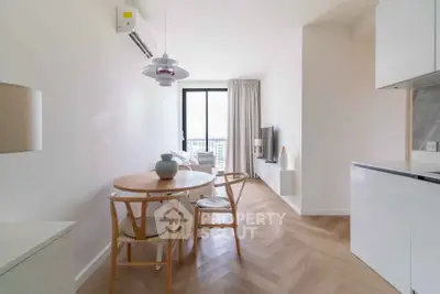 Modern minimalist living room with dining area and natural light