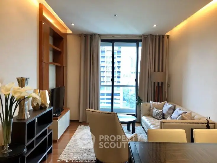 Elegant living room with modern decor and large window offering city view.