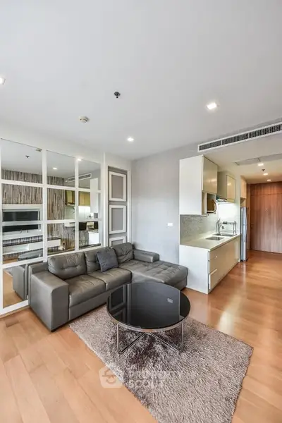 Modern living room with sleek kitchen in open layout apartment