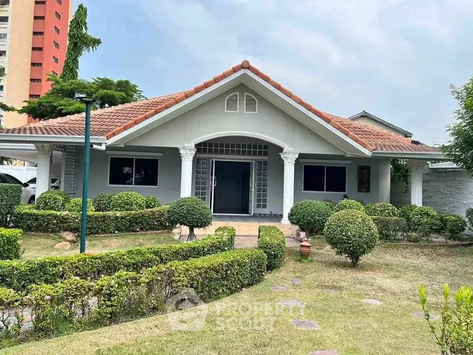 Charming single-story house with manicured garden and inviting entrance, perfect for family living.