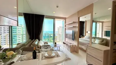 Luxurious condo with stunning ocean view, modern living room, and elegant dining area in prime location.