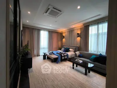 Luxurious modern living room with elegant decor and ample natural light