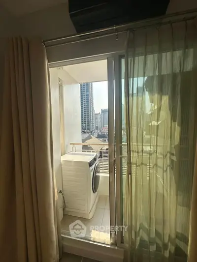 Cozy balcony with washing machine and city view