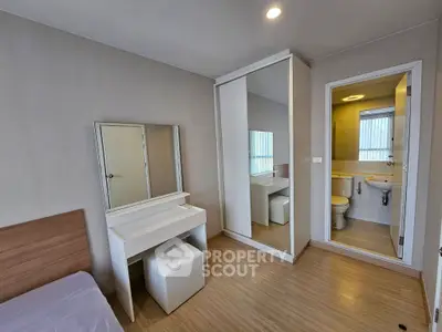 Modern bedroom with ensuite bathroom and stylish vanity area