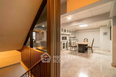 Spacious dining area with elegant marble flooring and classic furniture
