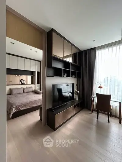 Modern apartment interior with stylish bedroom and cozy living area featuring large windows and elegant decor.