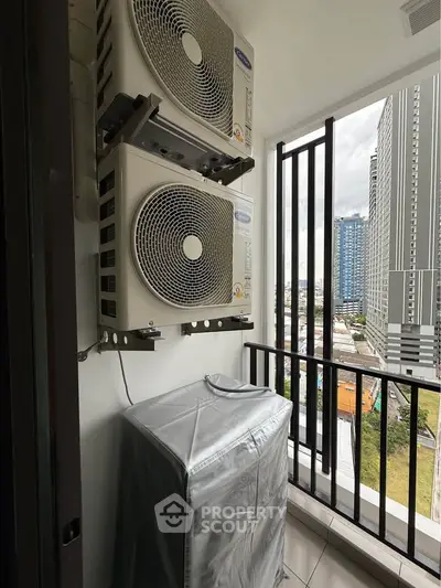 Modern balcony with air conditioning units and city view