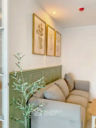 Cozy living room with elegant decor and plush sofa, perfect for relaxation.