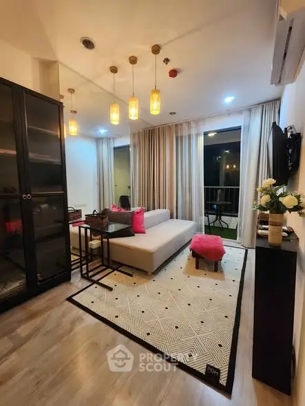 Modern living room with stylish decor and balcony access
