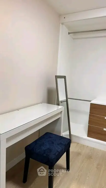 Spacious walk-in closet with modern design and elegant furnishings.