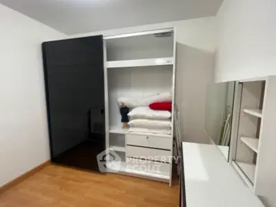 Spacious bedroom with sleek wardrobe and modern decor