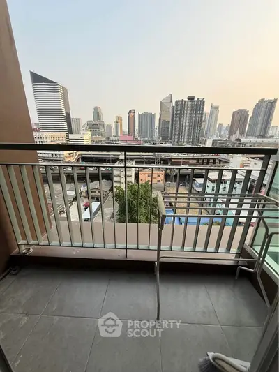 Stunning city view from a modern balcony in a high-rise apartment, perfect for urban living.