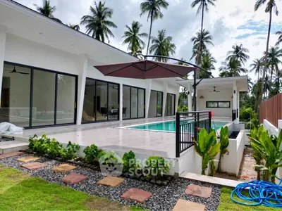 Luxurious modern villa with private pool and lush tropical garden, perfect for serene living.