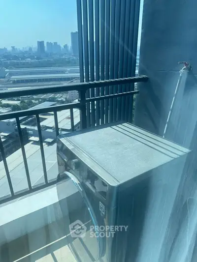 High-rise balcony with washing machine and stunning city view