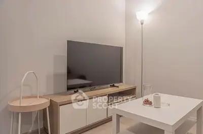 Modern living room with sleek TV stand and cozy lighting