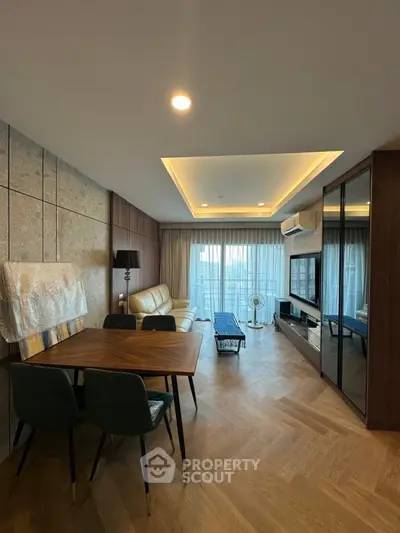 Modern living room with elegant decor and large windows offering a stunning view.
