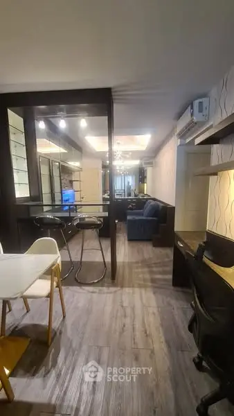 Modern open-plan living room with stylish decor and dining area