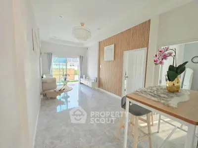 Bright and spacious living room with modern decor and large windows