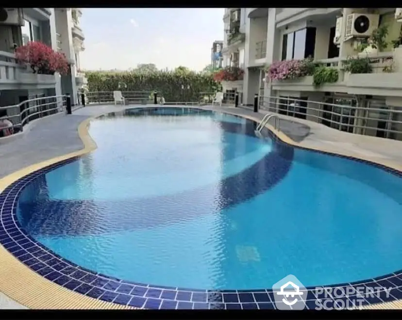 Luxurious residential pool area with modern design and serene ambiance.