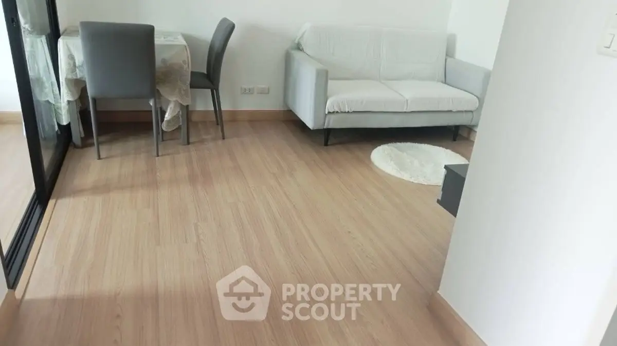 Modern living room with wooden flooring and cozy furniture