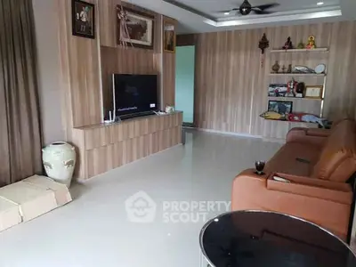 Spacious living room with modern decor and entertainment center