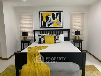 Stylish bedroom with modern decor and vibrant yellow accents