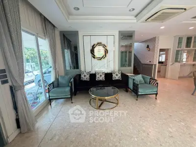 Luxurious living room with elegant decor and modern furniture, featuring a stylish coffee table and large windows.