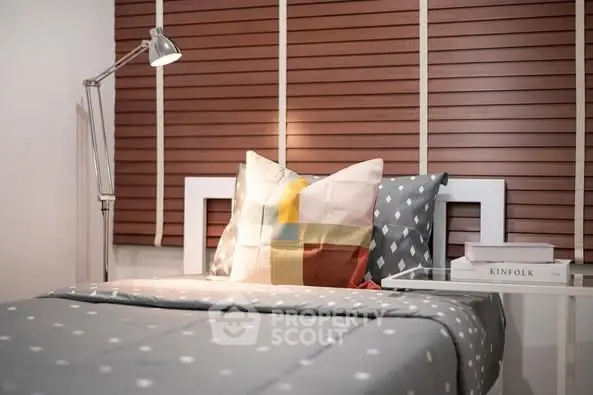 Cozy bedroom with stylish decor and modern lighting