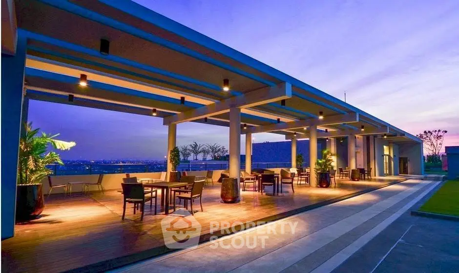 Stunning rooftop terrace with modern design and panoramic city views at sunset.