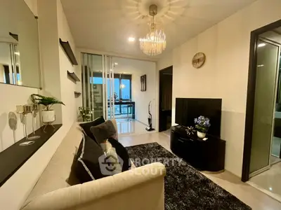 Stylish living room with modern decor and elegant lighting in a contemporary apartment.