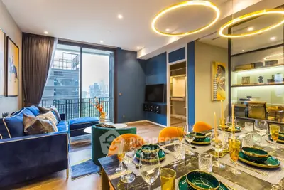 Luxurious modern living room with elegant dining area and city view balcony.