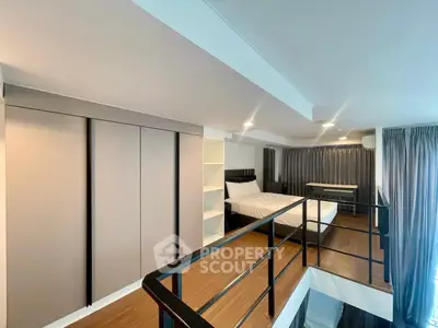 Modern loft bedroom with sleek design and ample natural light