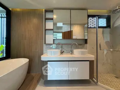 Luxurious modern bathroom with dual sinks and freestanding bathtub