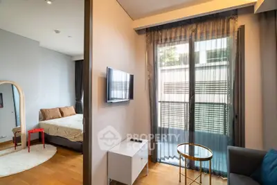 Modern apartment interior with cozy bedroom and stylish living area, featuring floor-to-ceiling windows.