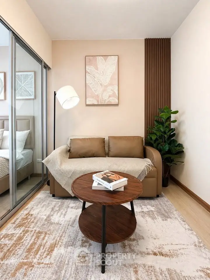 Modern living room with cozy sofa, stylish decor, and natural light in a contemporary apartment.