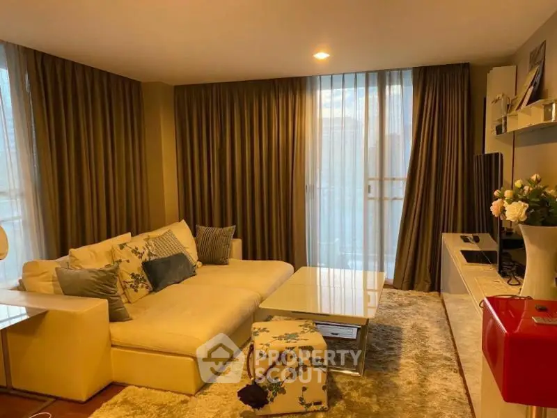 Cozy living room with elegant decor, plush sofa, and ambient lighting for a warm atmosphere.