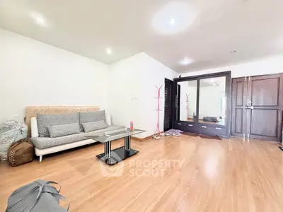 Spacious living room with modern furniture and wooden flooring
