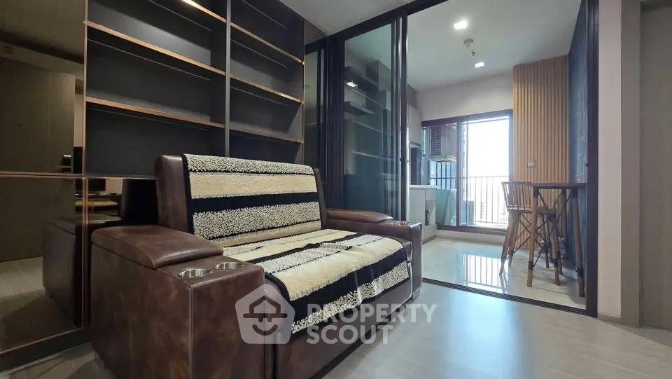 Modern living room with stylish leather sofa and open balcony view