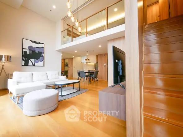 Spacious modern living room with high ceilings and elegant decor