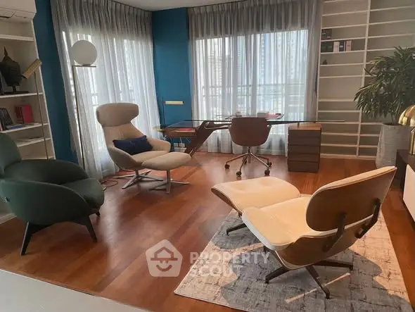 Stylish study room with modern furniture and large windows