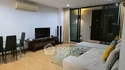 Modern living room with sleek furniture and balcony view