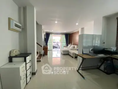 Spacious modern living room with sleek design and ample natural light