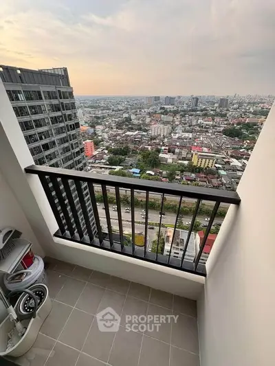 Stunning high-rise balcony with panoramic city view, perfect for urban living.