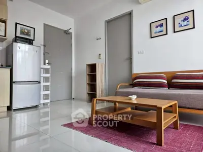 Modern living room with sleek furniture and bright decor in a stylish apartment.