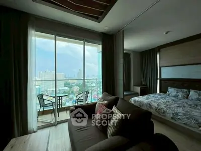 Luxurious high-rise condo with stunning city view, spacious living area, and cozy bedroom, perfect for urban living.