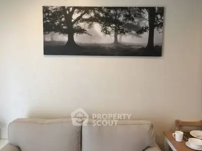 Cozy living room with elegant wall art and comfortable seating