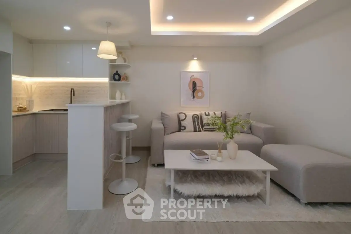 Modern living room with stylish decor and open kitchen layout