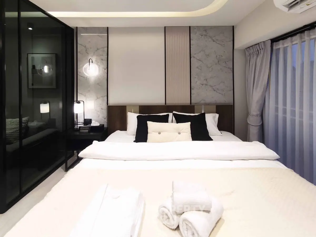 Luxurious modern bedroom with elegant decor and plush bedding